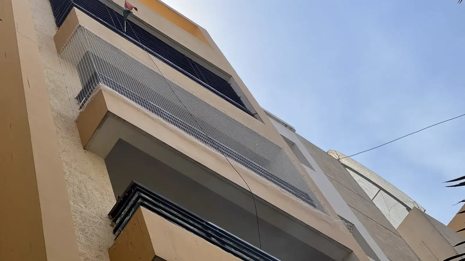 Safety net fitted on a building by Dhanush Safety Nets